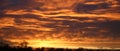 Panoramic view of dramatic fiery clouds at sunset Royalty Free Stock Photo