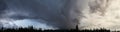 Panoramic view of dramatic sky, stormy clouds in dark sky Royalty Free Stock Photo