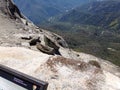 Standing at the edge of Moro Rock overlooking snowy mountains and valleys - Sequoia National Park Royalty Free Stock Photo