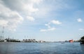 The panoramic view of the electric refinery plant and big red logistic ship