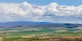 A panoramic view of Ellensburg, WA with a thunderstorm in the distance