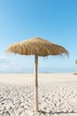 Panoramic view of empty broad beach with white sand blue sea sky straw umbrella volleyball net. Sunny summer day Royalty Free Stock Photo