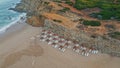 Panoramic view empty recliners umbrellas on seashore. No people beach coastline Royalty Free Stock Photo