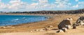 Wide panoramic view of empty sandy beach and blue sea Royalty Free Stock Photo