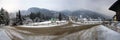 A panoramic view of empty snowy streets of Mayrhofen village and Ahorn mountain in the background