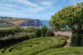 View of Etretat coastline with its famous natural stone arch from the Etretat gardens. Normandy, France. Royalty Free Stock Photo