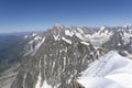 A panoramic view of European Alps on a sunny day. Mount Blanc as a highest mountain in Europe covered with snow and glacier. Royalty Free Stock Photo