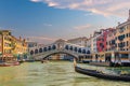 Panoramic view of famous Canal Grande with famous Rialto Bridge at sunset, Venice Royalty Free Stock Photo