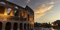 Panoramic view with  the famous of the Coliseum or Flavian Amphitheatre Amphitheatrum Flavium or Colosseo,  sunset sky scene  at Royalty Free Stock Photo