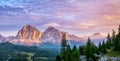 Panoramic view of famous Dolomites mountain peaks glowing in beautiful golden evening light at sunset in summer, South Tyrol, Royalty Free Stock Photo