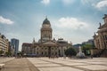 Panoramic view of famous Gendarmenmarkt square with Berlin Concert Hall and German Cathedral in golden evening light at sunset