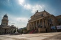 Panoramic view of famous Gendarmenmarkt square with Berlin Concert Hall and German Cathedral in golden evening light at sunset