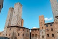 Panoramic view of famous Piazza del Duomo in the historic town of San Gimignano on a sunny day Royalty Free Stock Photo