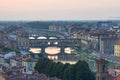 Panoramic view of famous Ponte Vecchio bridge with river Arno at sunset in Florence, Italy Royalty Free Stock Photo