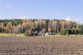 Panoramic view of farm with neatly plowed field Royalty Free Stock Photo