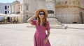 Panoramic view of fashionable cheerful woman in Otranto, Salento, Italy