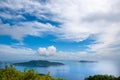 Panoramic view of Felicite and Marianne island from the Nid DÃ¢â¬â¢Aigles top hill point, with blue sky reflected on the sea.