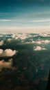 Panoramic view of fields and clouds from airplane window Royalty Free Stock Photo