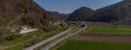 Panoramic view of fields, road and train track at Tremerje, between Lasko and Celje in Slovenia on a warm spring day