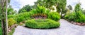 Panoramic view of flora garden with cement pathway