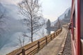 Panoramic view of the forest lake. Clear blue sky with dramatic glowing clouds after the rain. The Poschiavo lake in Switzerland Royalty Free Stock Photo