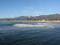 Panoramic view of Forte dei marmi coast with Apuan alps in background in winter . Tuscany, Italy