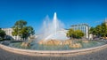 Panoramic view of fountain called Hochstrahlbrunnen at Schwarzenbergplatz square in downtown of Vienna illuminated by sunset, Royalty Free Stock Photo