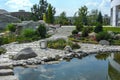 View out the pond to scenery style rock garden. Royalty Free Stock Photo