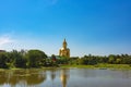 Panoramic view of Giant sitting Buddha against tropical landscape