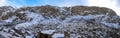 Panoramic view of Gloppedalsura geopark tourist landmark with natural quarry of house size rocks covered by snow near Byrkjedal