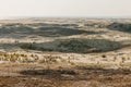 Panoramic view of the golden sand dunes of the Curonian Spit. The coastline of the Baltic Sea, forest belt, shrubs and Royalty Free Stock Photo