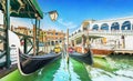 Panoramic view of Gondolas and boat at their moorings against famous Rialto Bridge at Grand Canal in Venice, Italy, Europe Royalty Free Stock Photo