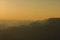 Panoramic View of Grand Canyon in amber colors after sunset Royalty Free Stock Photo