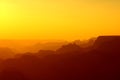 Panoramic View of Grand Canyon in yellow and red colors after sunset