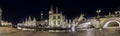 Panoramic view of the Graslei, quay in the promenade next to river Lys in Ghent, Belgium and St Michael`s Bridge at dusk. Royalty Free Stock Photo