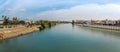 Panoramic view of Guadalquivir River with Triana and Torre del Oro (Golden Tower) - Seville, Spain Royalty Free Stock Photo