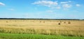 Panoramic view of hay bales field. Summer country landscape Royalty Free Stock Photo