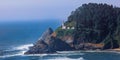 Panoramic view of Heceta Head Lighthouse on the cliff along Pacific coast of Oregon during twilight Royalty Free Stock Photo