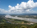 The panoramic view from the high mountain to the small town near the large river. Royalty Free Stock Photo