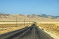 Highway crossing a mountainous and desert area of California, US Royalty Free Stock Photo