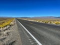 Panoramic view of Highway 50 or US Route 50, an endless and empty road surrounded by beautiful mountains. Royalty Free Stock Photo
