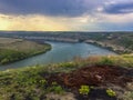 Panoramic view from the hill on bend of the river. Beautiful summer landscape. Colorful clouds of the morning sky. Dniester Canyon Royalty Free Stock Photo