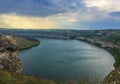 Panoramic view from the hill on bend of the river. Beautiful summer landscape. Colorful clouds of the morning sky Royalty Free Stock Photo