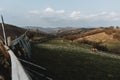 Panoramic view of hills in romania with leading line of old wooden fence around green pasture with cows during spring day Royalty Free Stock Photo