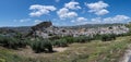 Panoramic view of hillside town with olive trees and castle Royalty Free Stock Photo