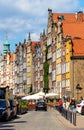 Panoramic view of historic old town city center quarter with tourists sightseeing along Piwna street in Gdansk, Poland