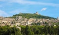 Panoramic view of the historic town of Assisi in beautiful sunny day with blue sky and clouds in summer, Umbria, Italy Royalty Free Stock Photo