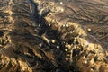 Panoramic view on Hot air balloons flying over spectacular Cappadocia during sunrise Royalty Free Stock Photo