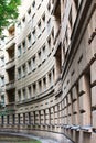 Panoramic view of a house in the city of St. Petersburg. Architectural solution with several balconies. Beige color plaster. Royalty Free Stock Photo