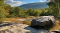 Panoramic view of huge rock with mountains and forest in the background